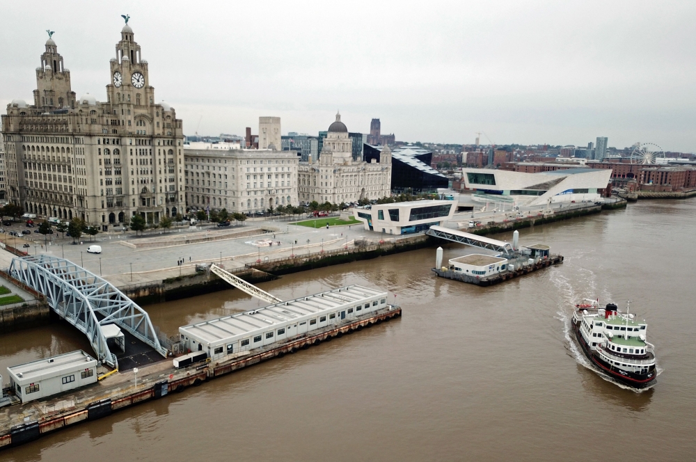 A Mersey Ferry pulling away from Pier Head, near the Liver Building, as it travels on the River Mersey. - AFP File Photo