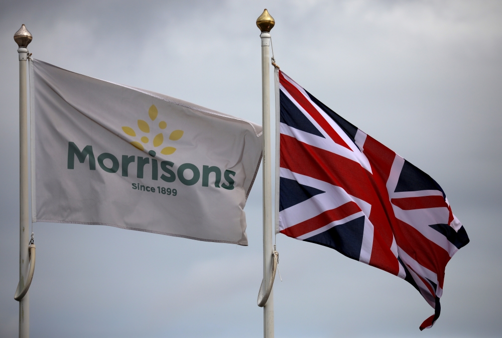 Flags fly outside a Morrisons supermarket in New Brighton. - Reuters