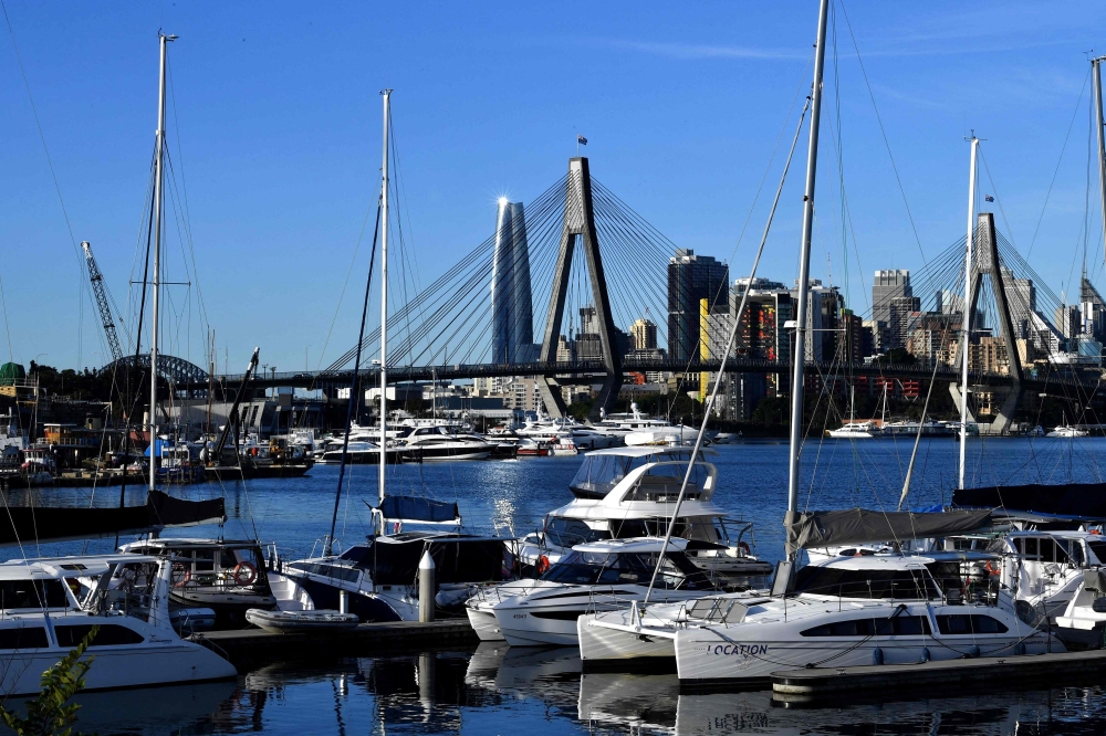 A general view of a quiet harbour during lockdown in Sydney may have prevented a tidal wave of cases, but have so far failed to stop the outbreak. - AFP