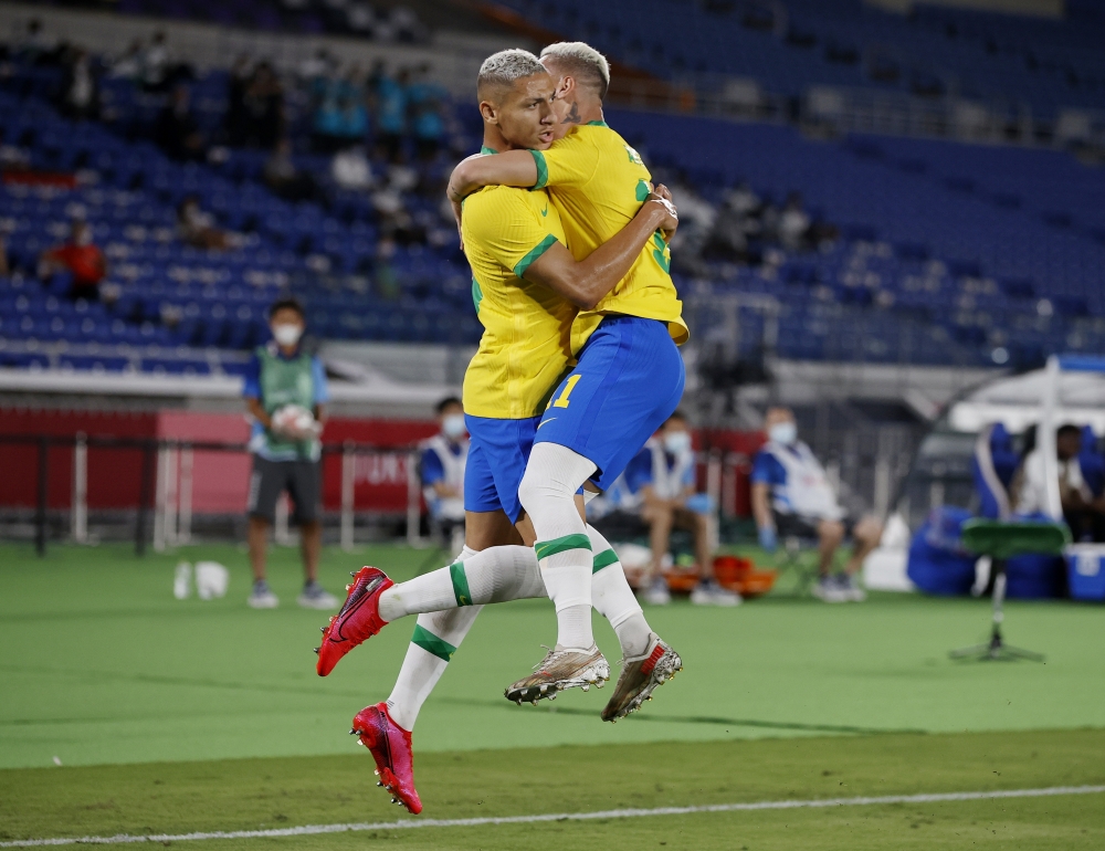 Brazil's Richarlison celebrates scoring their first goal with Antony. -- Reuters