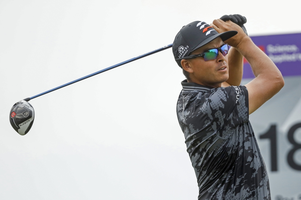 Rickie Fowler drives from the 18th tee during the first round of the 3M Open golf tournament. -- USA Today Sports
