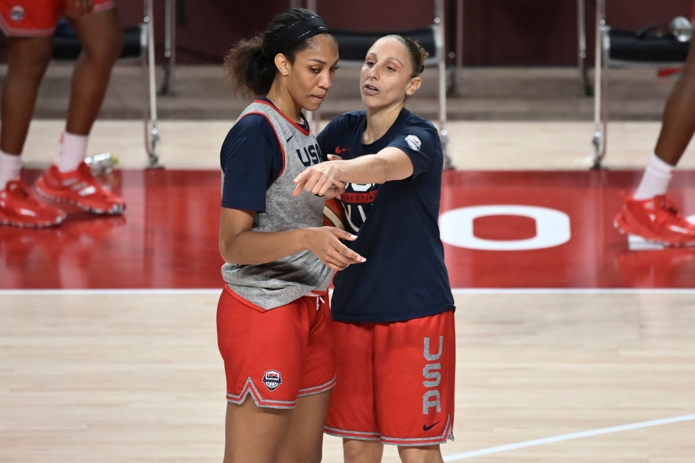 USA's basketball players Diana Taurasi (R) and A'ja Wilson attend a training session during the Tokyo 2020 Olympic Games at the Saitama Super Arena in Saitama on July 24, 2021.  (Photo by ARIS MESSINIS / AFP)

