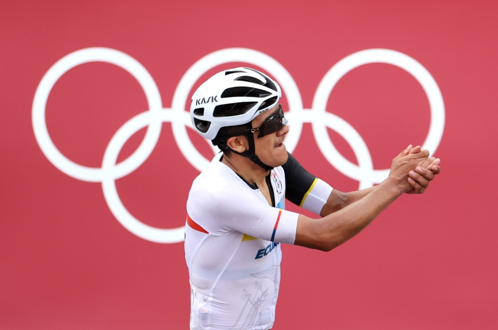 Richard Carapaz of Ecuador celebrates winning gold. 

