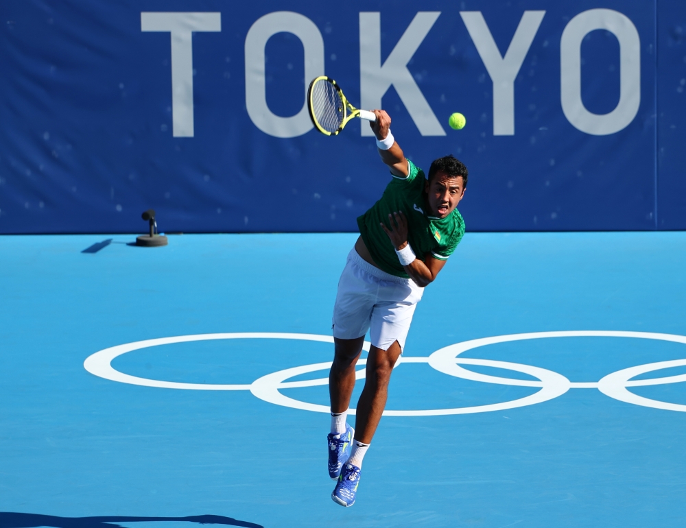 Hugo Dellien of Bolivia in action during his first round match against Novak Djokovic of Serbia 
