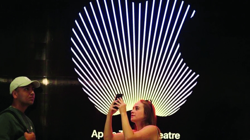 Customers walk around the new Apple Store on Broadway in downtown Los Angeles. — Reuters 