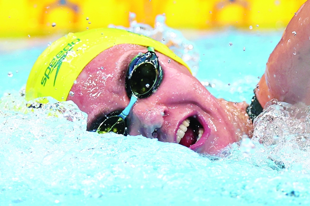 Ariarne Titmus of Australia takes part in women's 200m freestyle swimming. -- Reuters