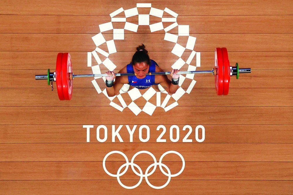 Philippines' Hidilyn Diaz competes in the women's 55kg weightlifting competition. -- AFP