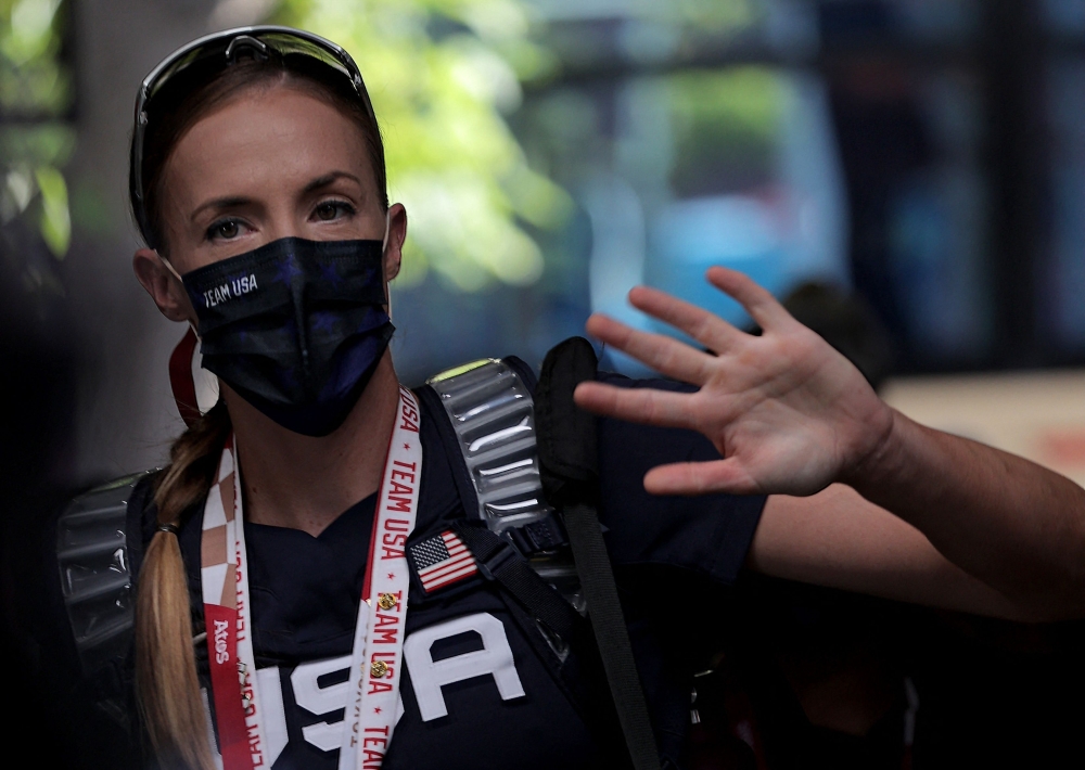 USA's Monica Abbott waves while arriving at the stadium for the Tokyo 2020 Olympic Games softball gold medal game between Japan and USA at the Yokohama Baseball Stadium in Yokohama, Japan, on July 27, 2021. 