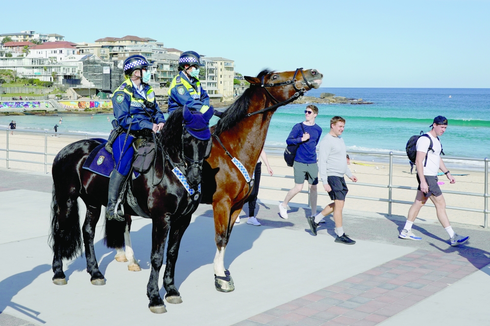 Mounted police officers patrol at Bondi Beach during a lockdown to curb the spread of a Covid-19 outbreak in Sydney, on Tuesday. - Reuters