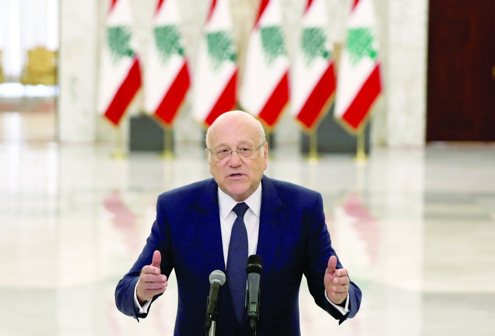 Prime Minister-designate Najib Mikati gestures as he talks at the presidential palace in Baabda, on Monday. - Reuters