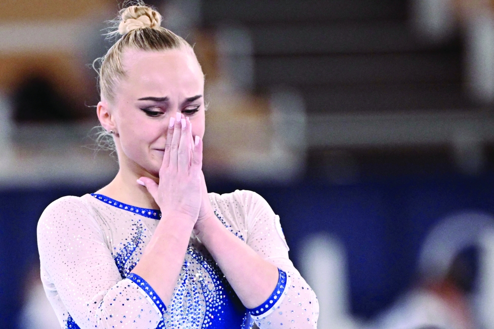 Russia's Angelina Melnikova celebrates winning the artistic gymnastics women's team final. -- AFP

