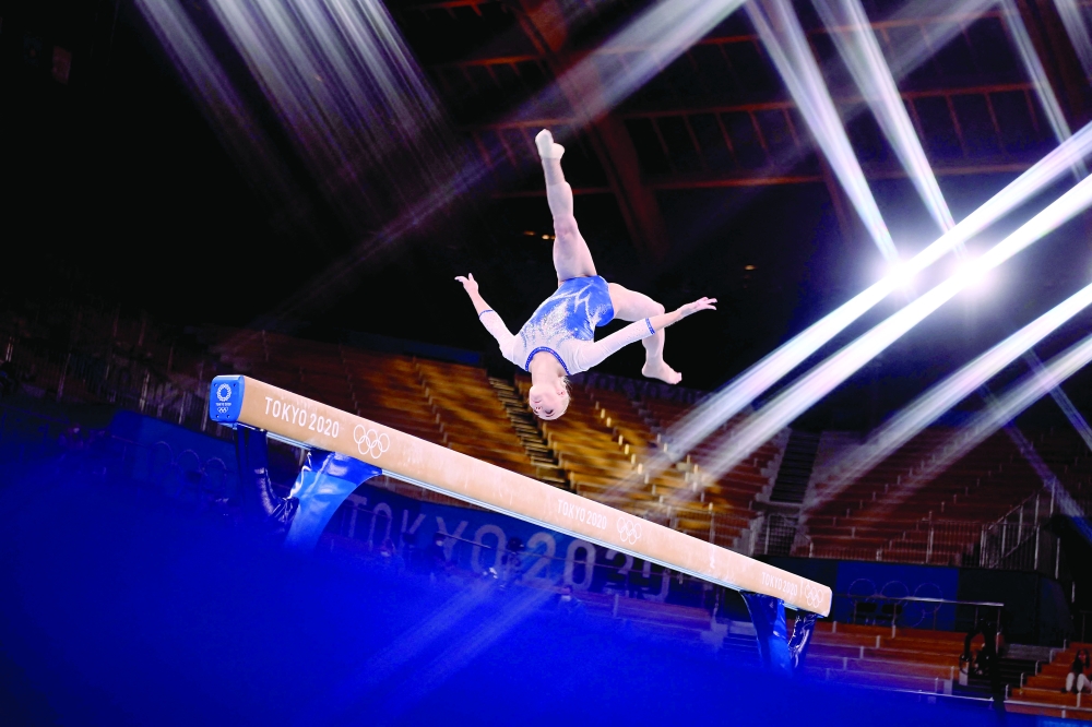 Russia's Angelina Melnikova competes in the balance beam event of the artistic gymnastics women's team final. -- AFP