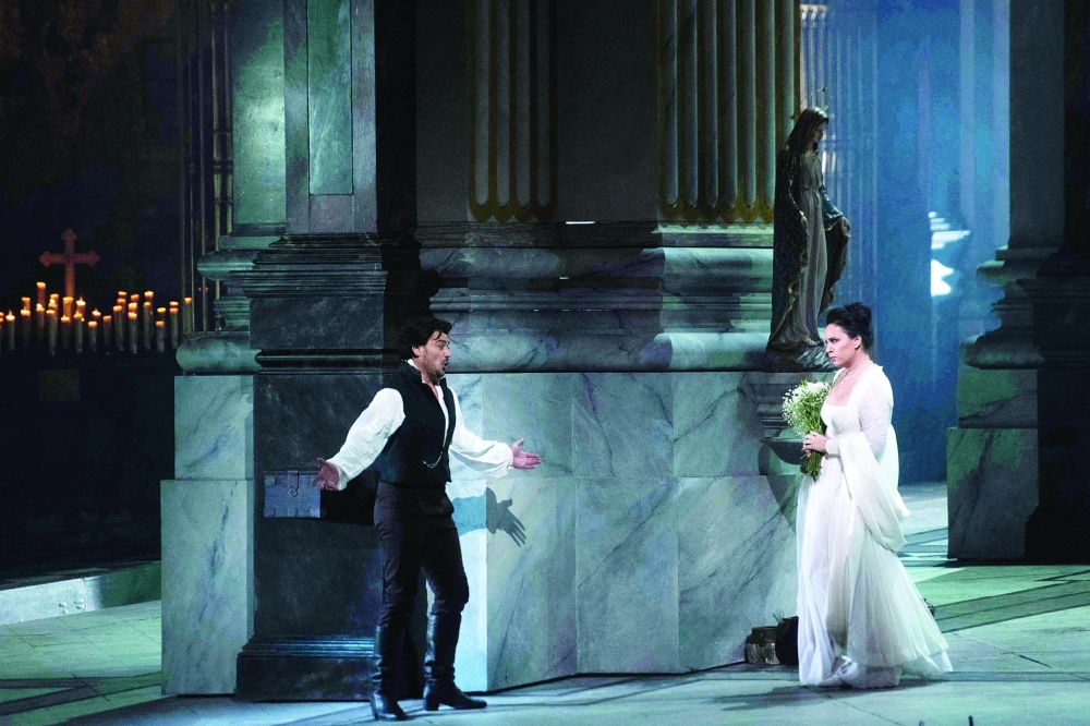 (FILES) In this file photo Sonya Yoncheva, who plays the title role of the fiery diva, and Vittorio Grigolo, who plays her passionate lover, Cavaradossi, perform in “Tosca” at the Metropolitan Opera in New York on January 23, 2018.  New York's Metropolitan Opera will require audiences and performers to be fully vaccinated for its upcoming season, the house announced on July 27, 2021 amid debate in the United States about mandatory vaccinations. The Met said all customers, staff and members of its orchestra and chorus will need to show proof of vaccination against Covid-19 for performances in the 2021–22 season.

 - 
 (Photo by Jewel SAMAD / AFP)

