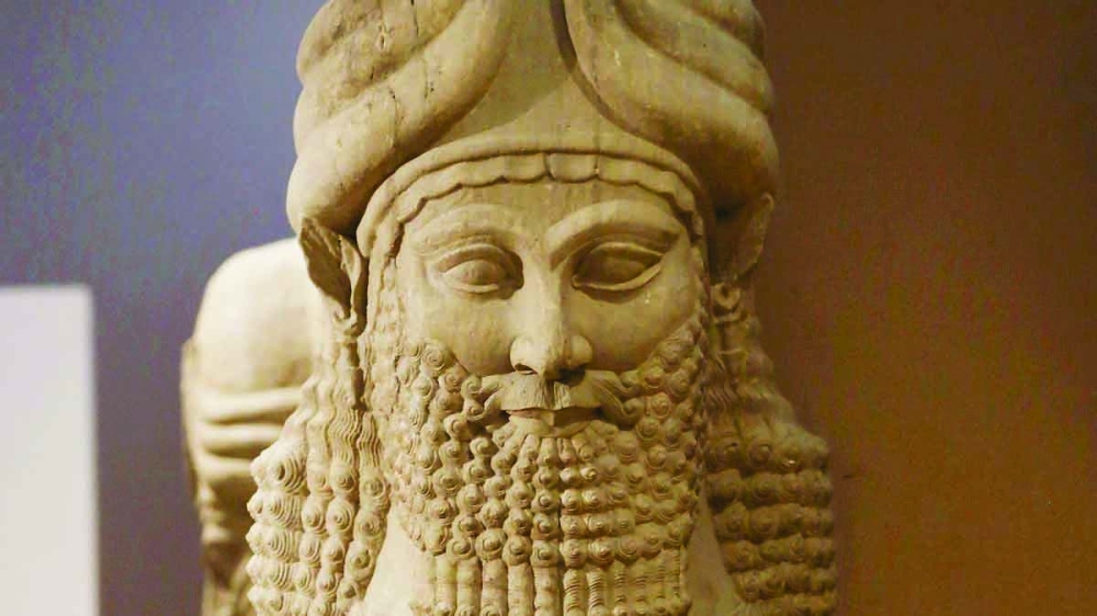 An Assyrian artefact of the head of a winged bull made out of limestone is displayed at the Iraqi National Museum in Baghdad in 2015. 