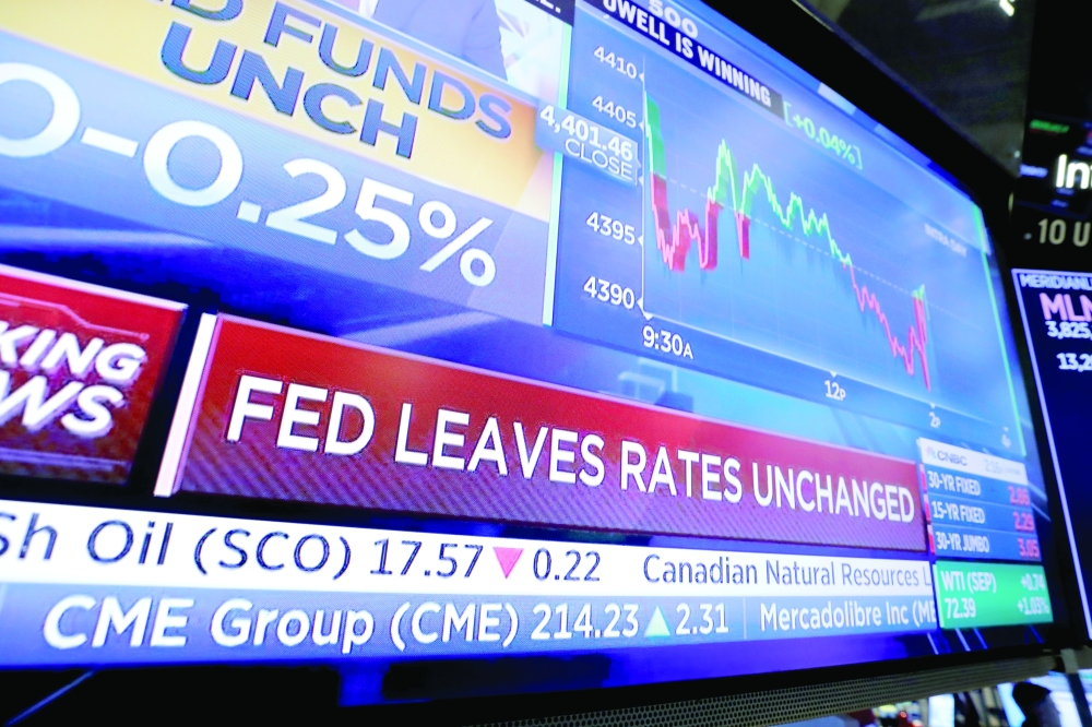 A screen displays the US Federal Reserve's announcement on the trading floor at New York Stock Exchange in New York City. - Reuters
