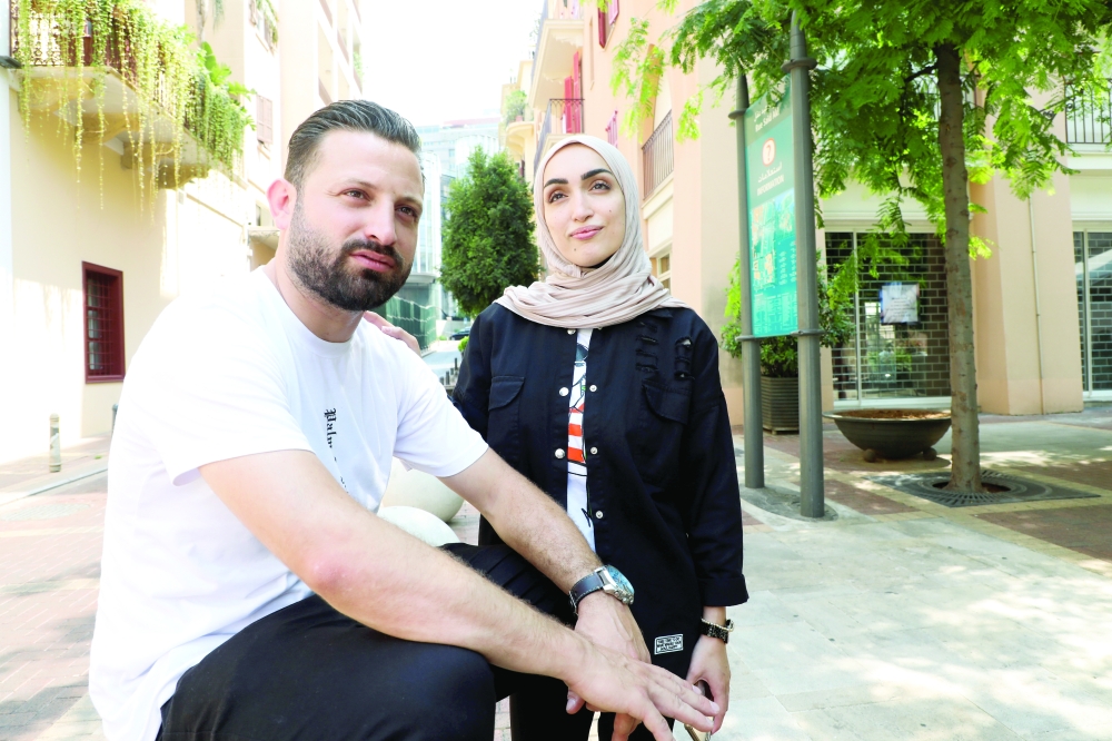 Israa Seblani, a Lebanese doctor, poses with her husband Ahmad Subeih in Beirut. - Reuters