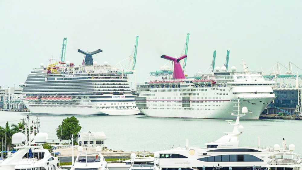 Cruise Ships Carnival Vista, left, and Carnival Sensation from Carnival Cruise Line, are seen docked at Port Miami after the CDC released a new phase of the Framework for Conditional Sailing Order for cruise ships operating or seeking to operate in US waters. 