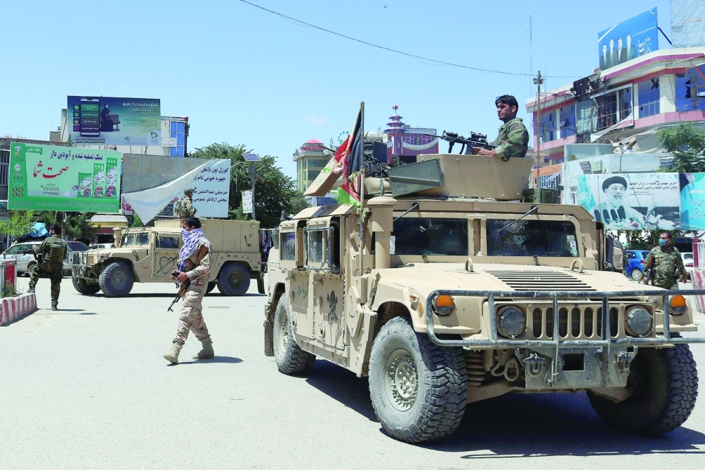 Afghan security forces sit in a Humvee vehicle amid ongoing fighting between Taliban militants and Afghan security forces in Kunduz on May 19, 2020. - AFP file photo