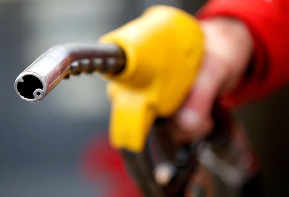A petrol attendant prepares to refuel a car in Rome, Italy. — Reuters