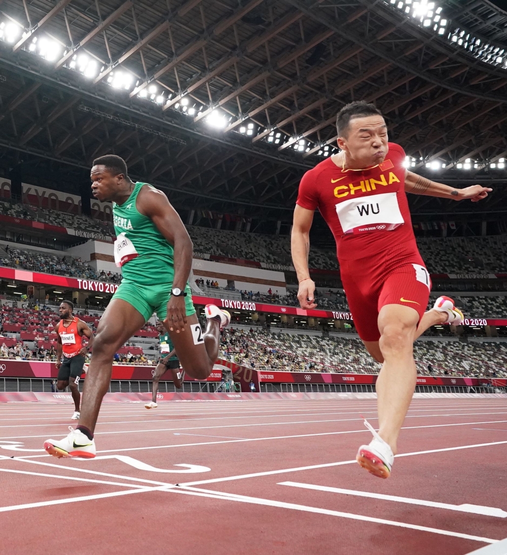 Wu Zhiqiang of China and Usheoritse Itsekiri of Nigeria in action