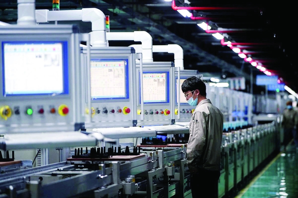 A man works on the production line of electric vehicle (EV) battery manufacturer Octillion in Hefei, Anhui, China. — Reuters
