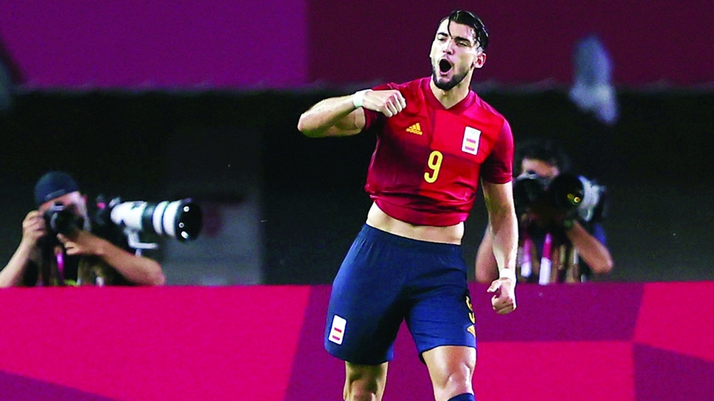 Rafa Mir of Spain celebrates scoring their fourth goal. -- Reuters