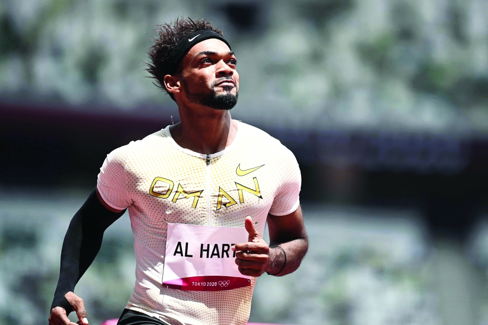 Oman's Barakat Al Harthi wins the men's 100m heat during the Tokyo 2020 Olympic Games. -- AFP

