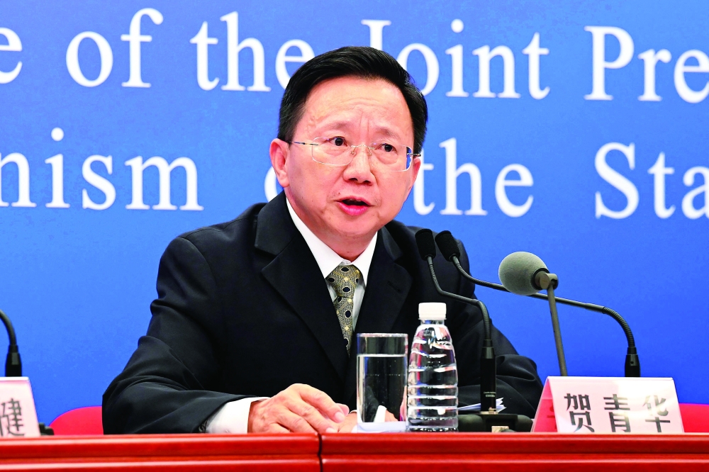 He Qinghua, inspector for China's National Health Commission's disease control and prevention bureau, at a press conference in Beijing. - AFP