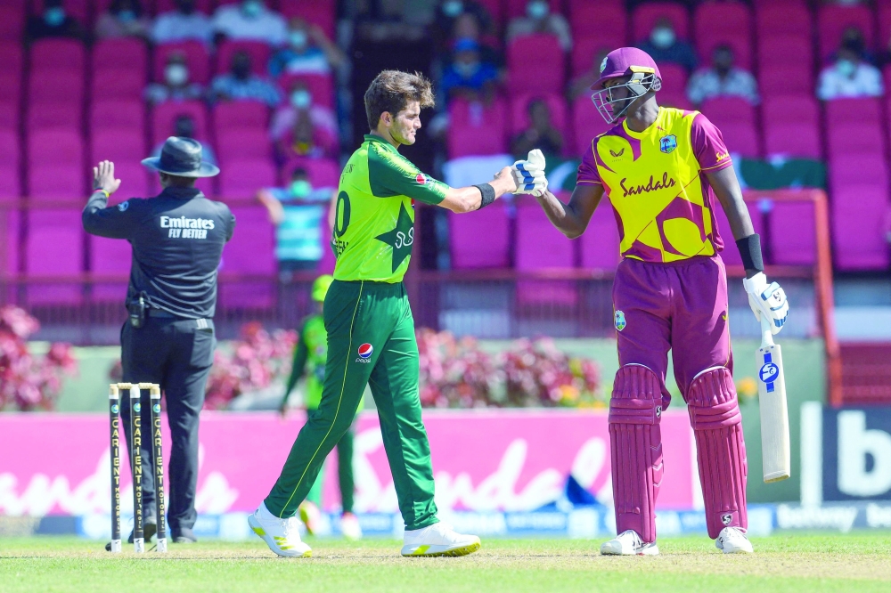 Jason Holder (R) of the West Indies congratulate Shaheen Shah Afridi of Pakistan for winning the second T20I match. -- AFP 