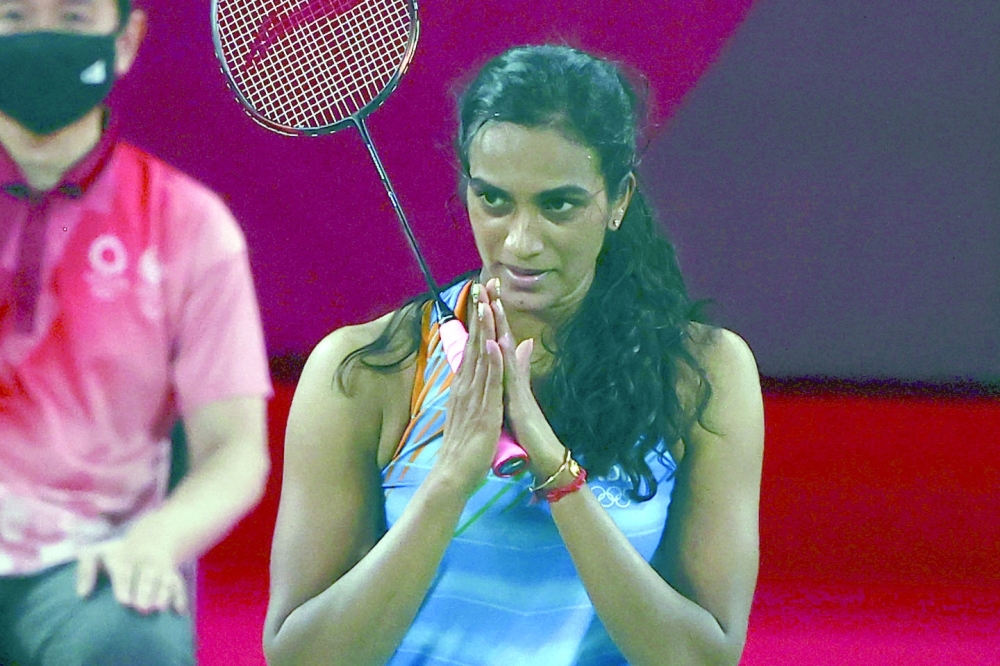 P.V. Sindhu of India gestures after winning her match against He Bingjiao of China. REUTERS