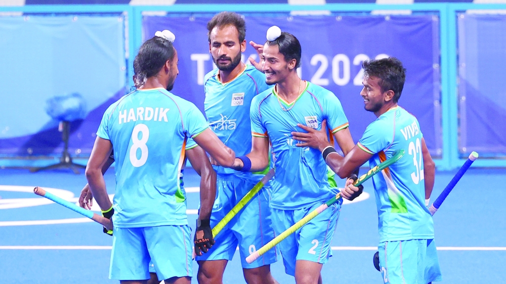 Dilpreet Singh of India celebrates with teammates after scoring. REUTERS/