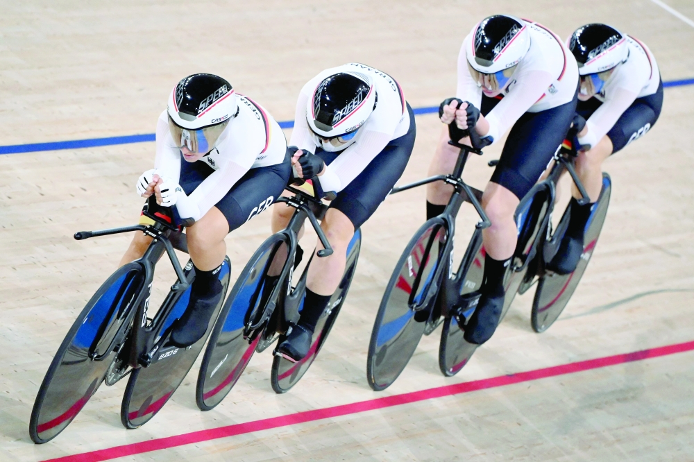 Germany's team compete to setting the new world record during the women's track cycling team pursuit finals. -- AFP 