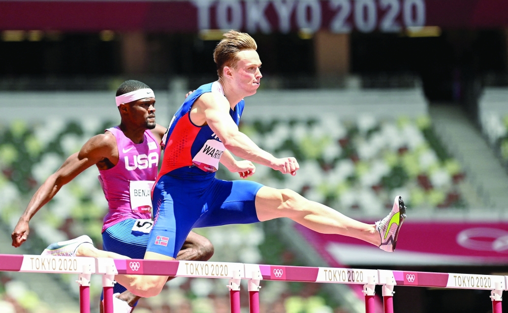Norway's Karsten Warholm (R) and USA's Rai Benjamin compete in  the men's 400m hurdles final. -- AFP