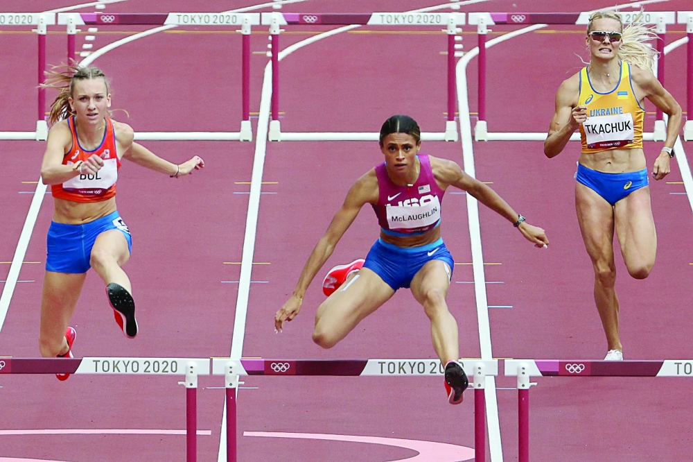 USA's Sydney Mclaughlin (C) wins the women's 400m hurdles final setting a new world record. -- AFP