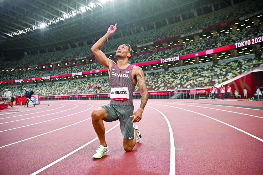 Canada's Andre De Grasse celebrates after winning the men's 200m final. -- AFP 