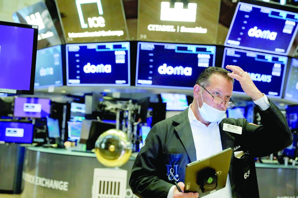 A trader works on the floor at the New York Stock Exchange (NYSE) in Manhattan, New York City. - Reuters 
