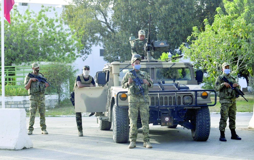Tunisian soldiers cordon off the Parliament in the capital Tunis, following a move by the president to suspend the country’s parliament and dismiss the Prime Minister. — AFP