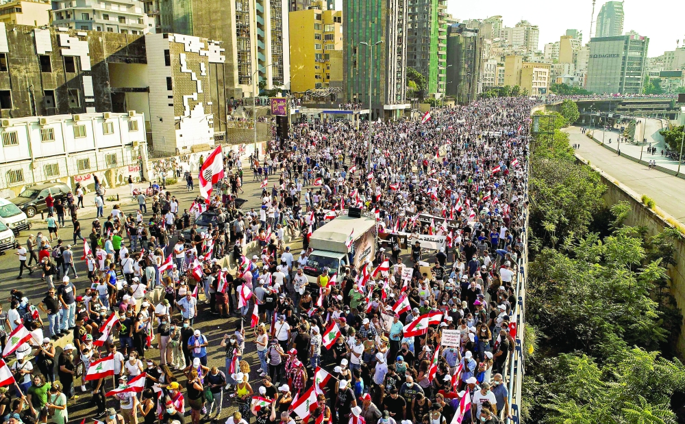 An aerial view of demonstrators gathered outside the port of Lebanon’s capital Beirut. — AFP