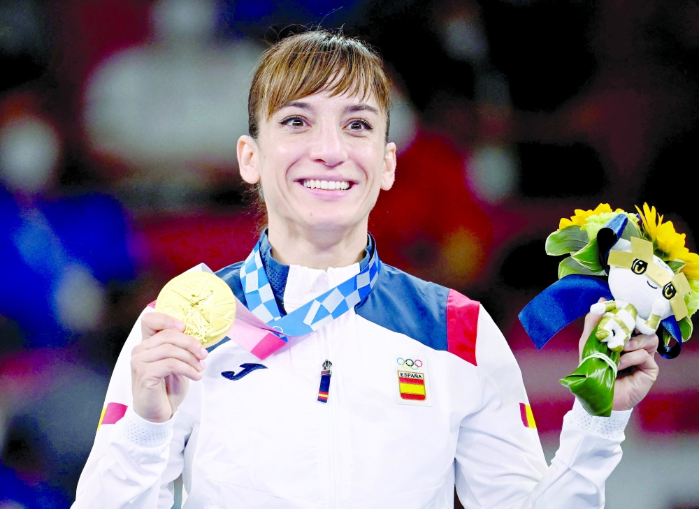 Spain's Sandra Sanchez Jaime poses with her women's kata gold medal in the karate competition. -- AFP 