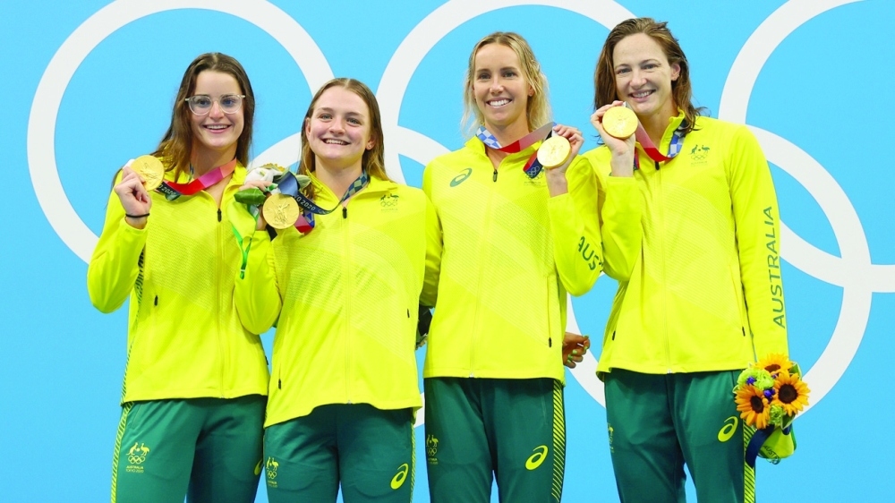 Cate Campbell, Emma McKeon, Chelsea Hodges and Kaylee McKeown of Australia celebrate with their gold medals. -- Reuters 