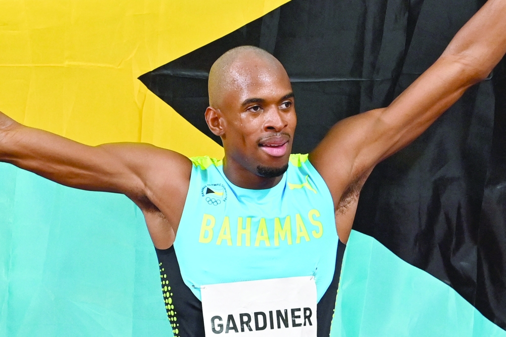 Gold medallist Bahamas' Steven Gardiner celebrates after the men's 400m final. -- AFP