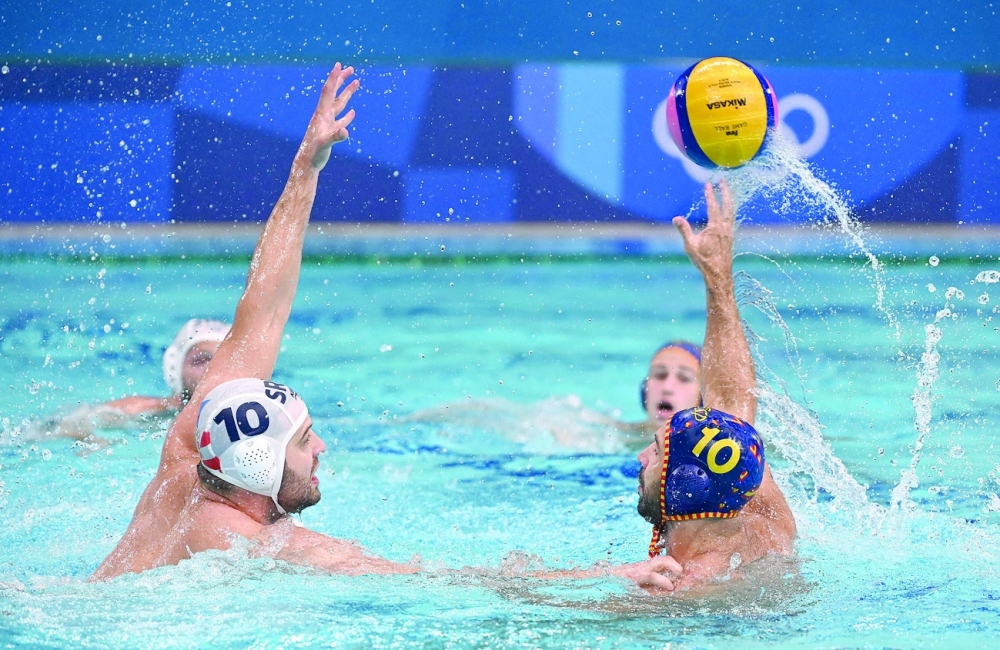 Serbia's Filip Filipovic (L) vies with Spain's Felipe Perrone Rocha during the Tokyo 2020 Olympic Games men's water polo semifinal. -- AFP

