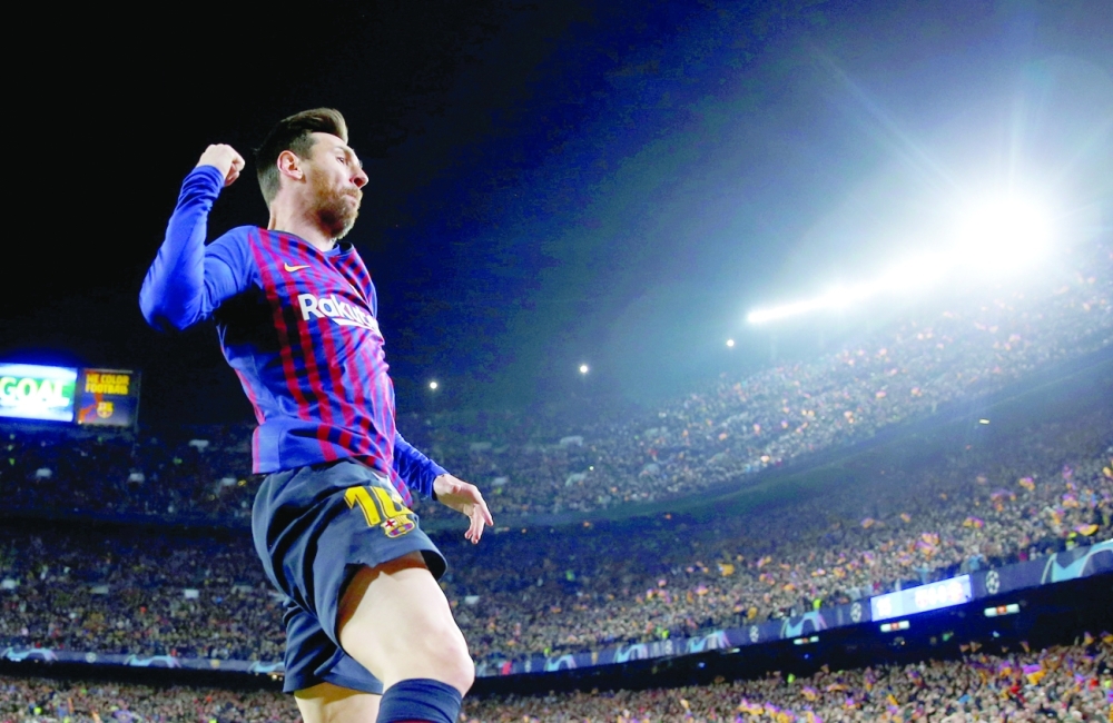 Barcelona's Lionel Messi celebrates scoring their first goal. -- Reuters