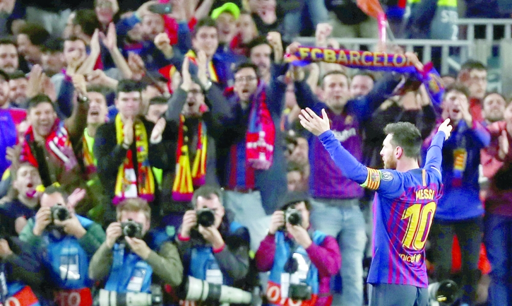 Barcelona's Lionel Messi celebrates scoring their second goal. -- Reuters