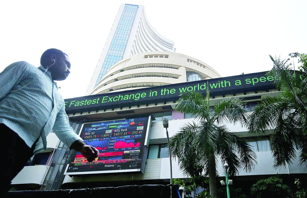 A man walks past the Bombay Stock Exchange building in Mumbai. — Reuters