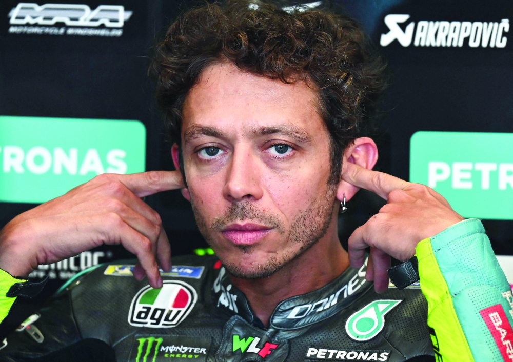 Yamaha-SRT Italian rider Valentino Rossi puts in his ear-plugs during the third free practice session ahead of the Styrian MotoGP in Spielberg. -- AFP