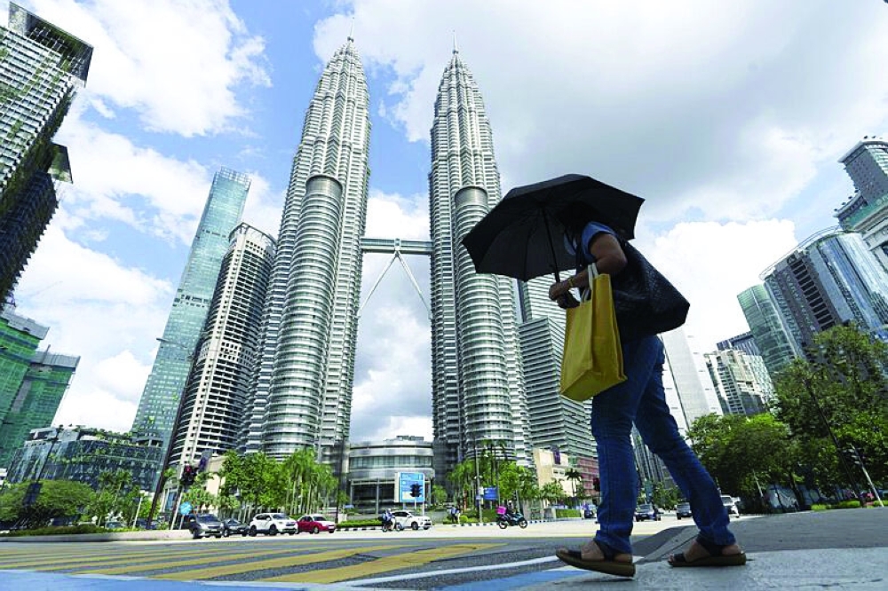 The curbs will not be lifted in states such as the capital Kuala Lumpur, which is recording thousands of new infections every day, and the commercial heartland of Selangor.
