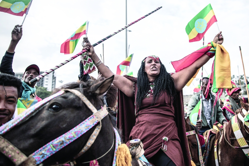A protester rides a horse, waving Ethiopian flags, during a rally against pro-TPLF forces (Tigray People's Liberation Front) and to support for Ethiopia's armed forces in Addis Ababa on Sunday. -- AFP 