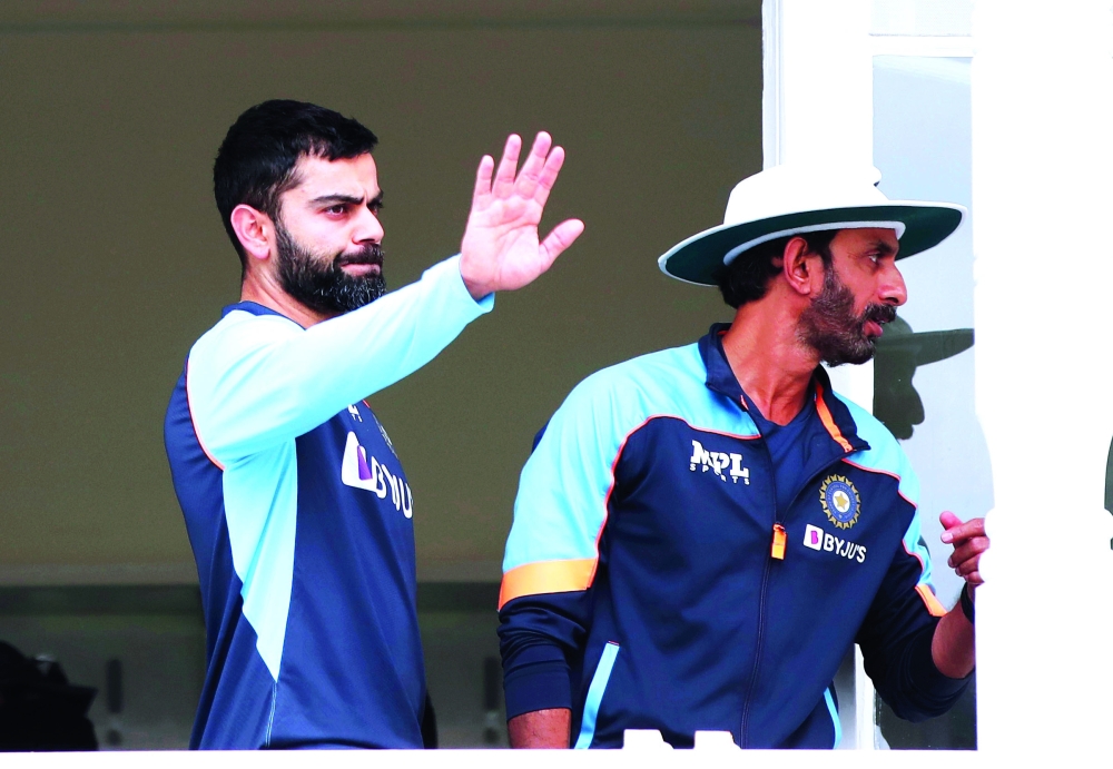 India's Virat Kohli as rain delays play. -- Reuters