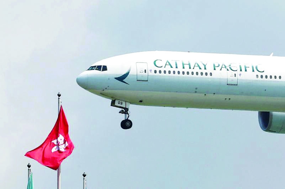 A Cathay Pacific Boeing 777-300ER plane lands at Hong Kong airport, in this file photo. — Reuters